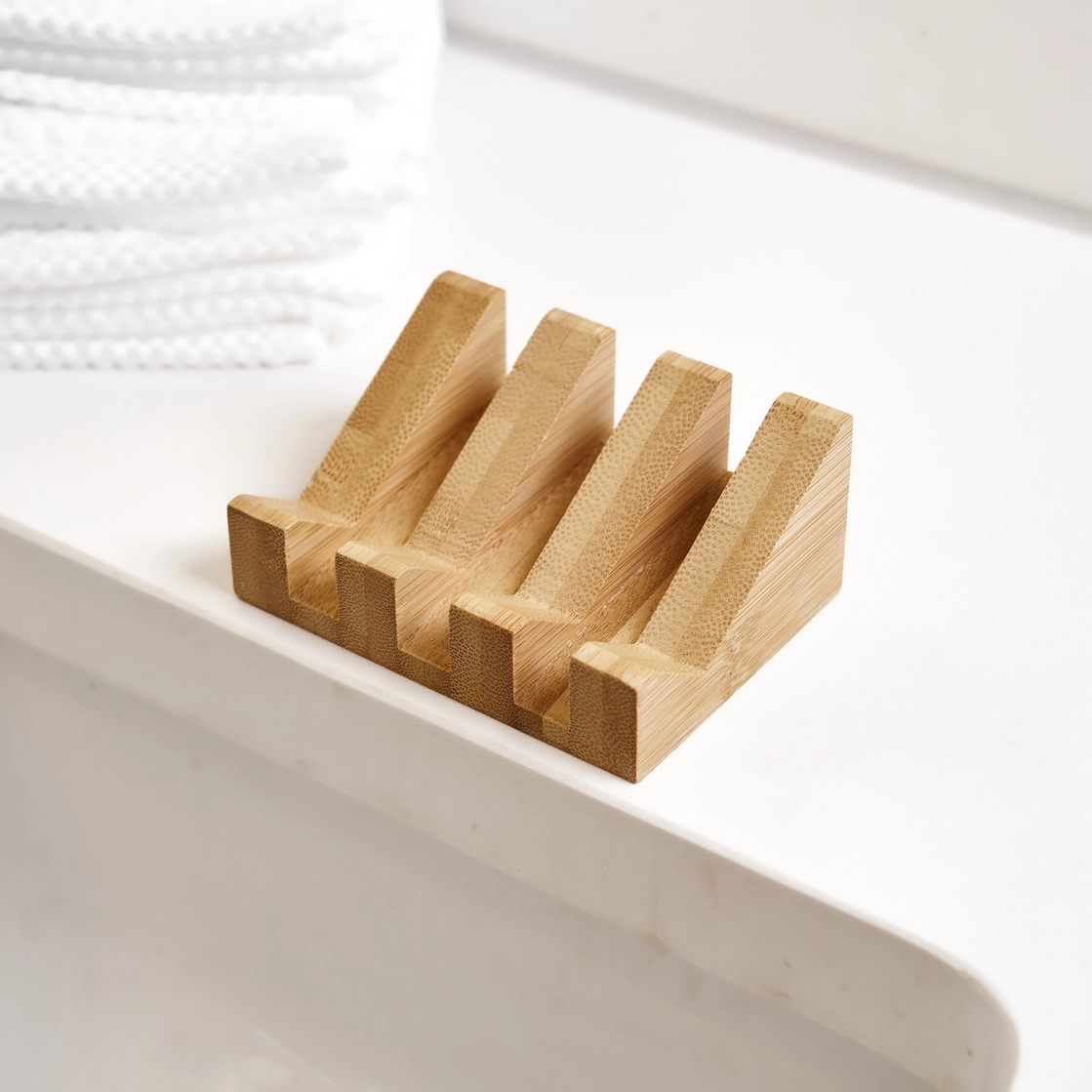 Wooden soap dish on a white surface